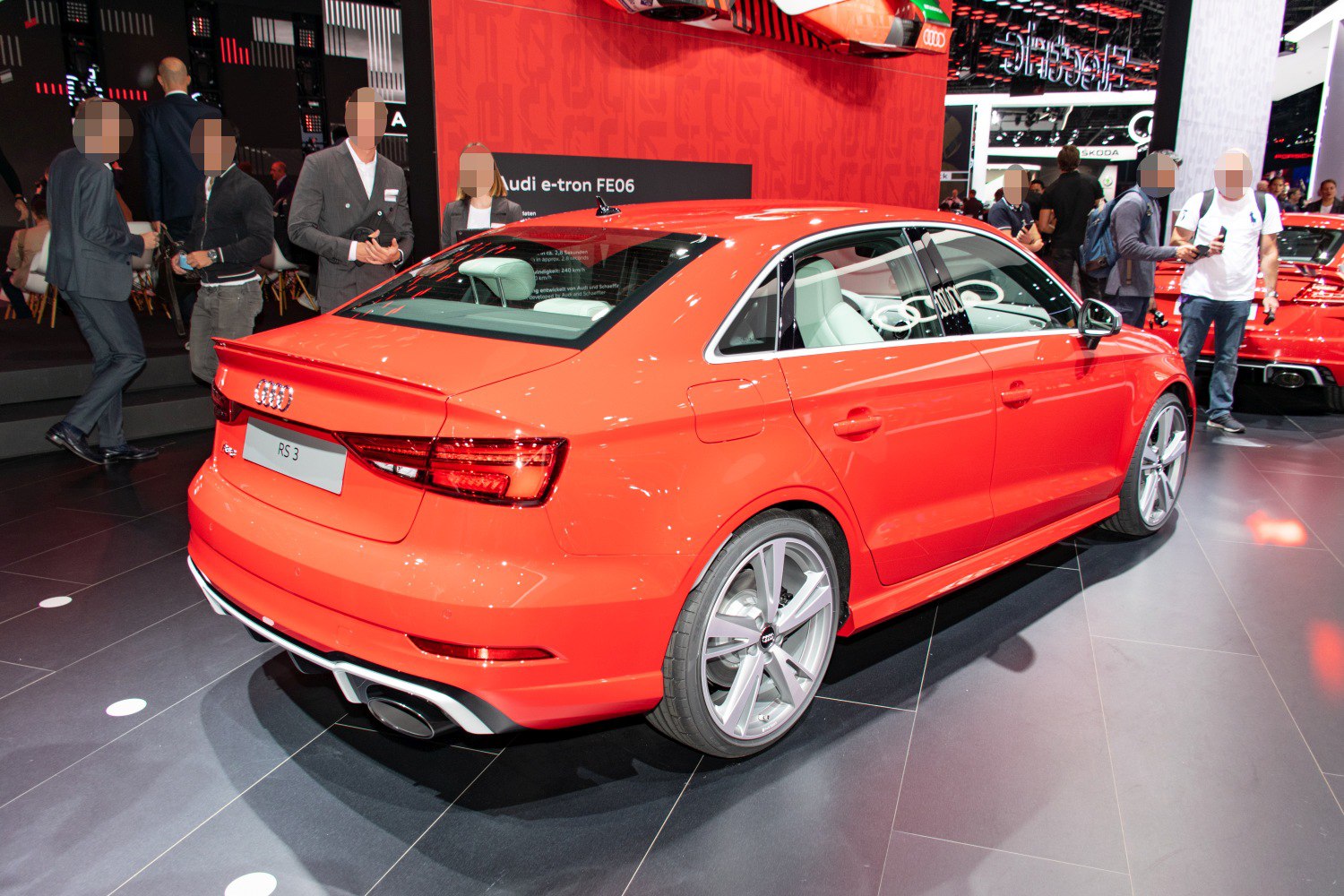 Rear view of sporty sedan with twin exhausts and alloy wheels