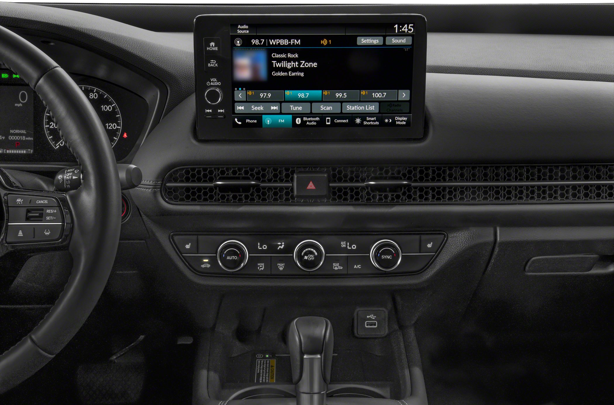 Touchscreen infotainment and dual-zone climate control system in car interior