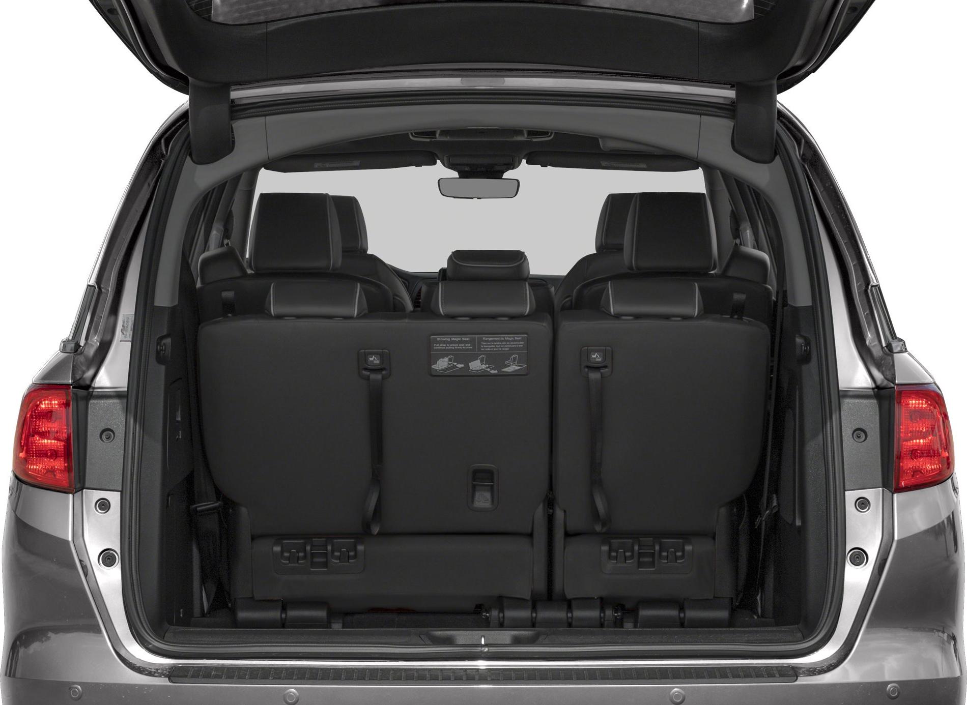 Open rear trunk with foldable third-row seats in a minivan