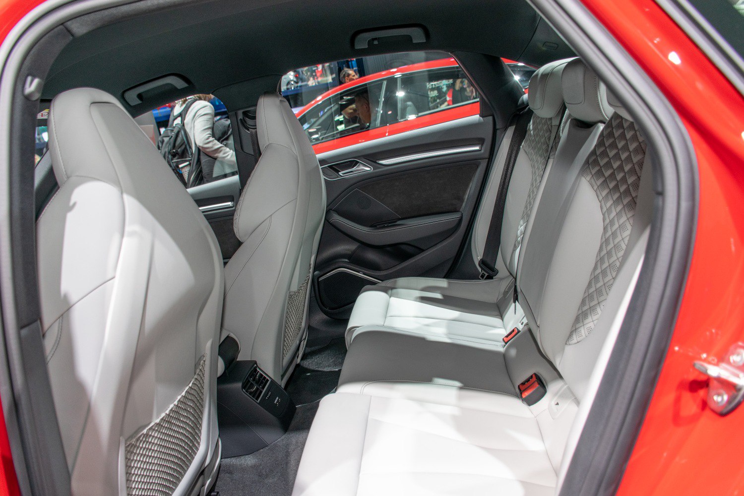 Rear view of leather seats and interior door panel in modern car rear cabin