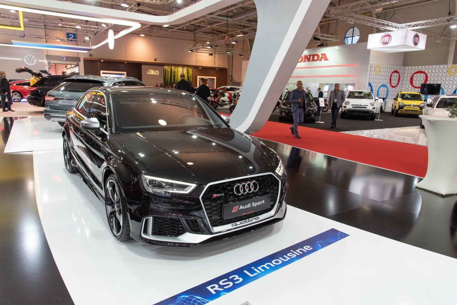 Black high-performance Quattro sports sedan with aggressive front grille and LED headlights