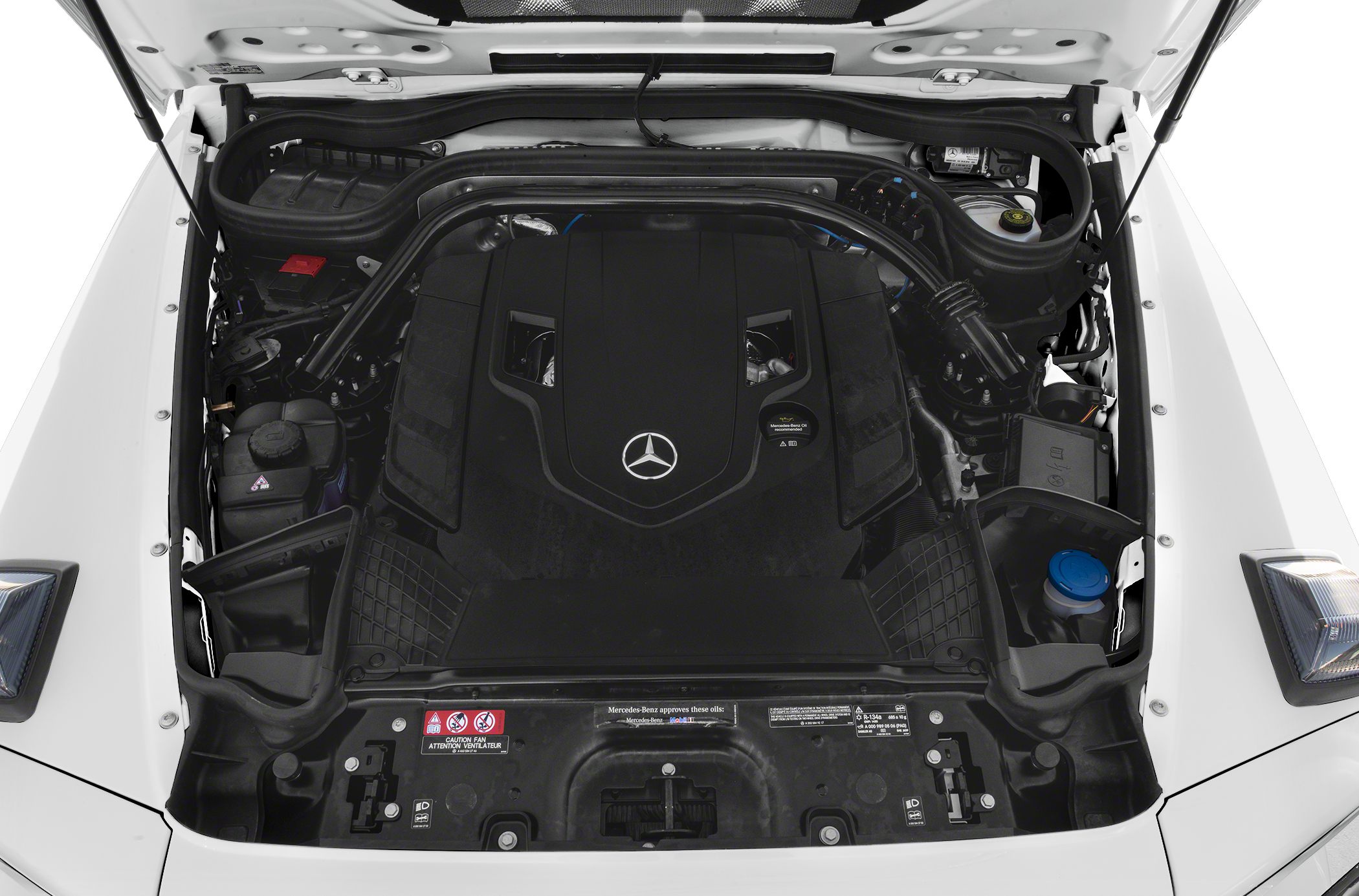 Engine bay with covered engine layout and visible fluid reservoirs