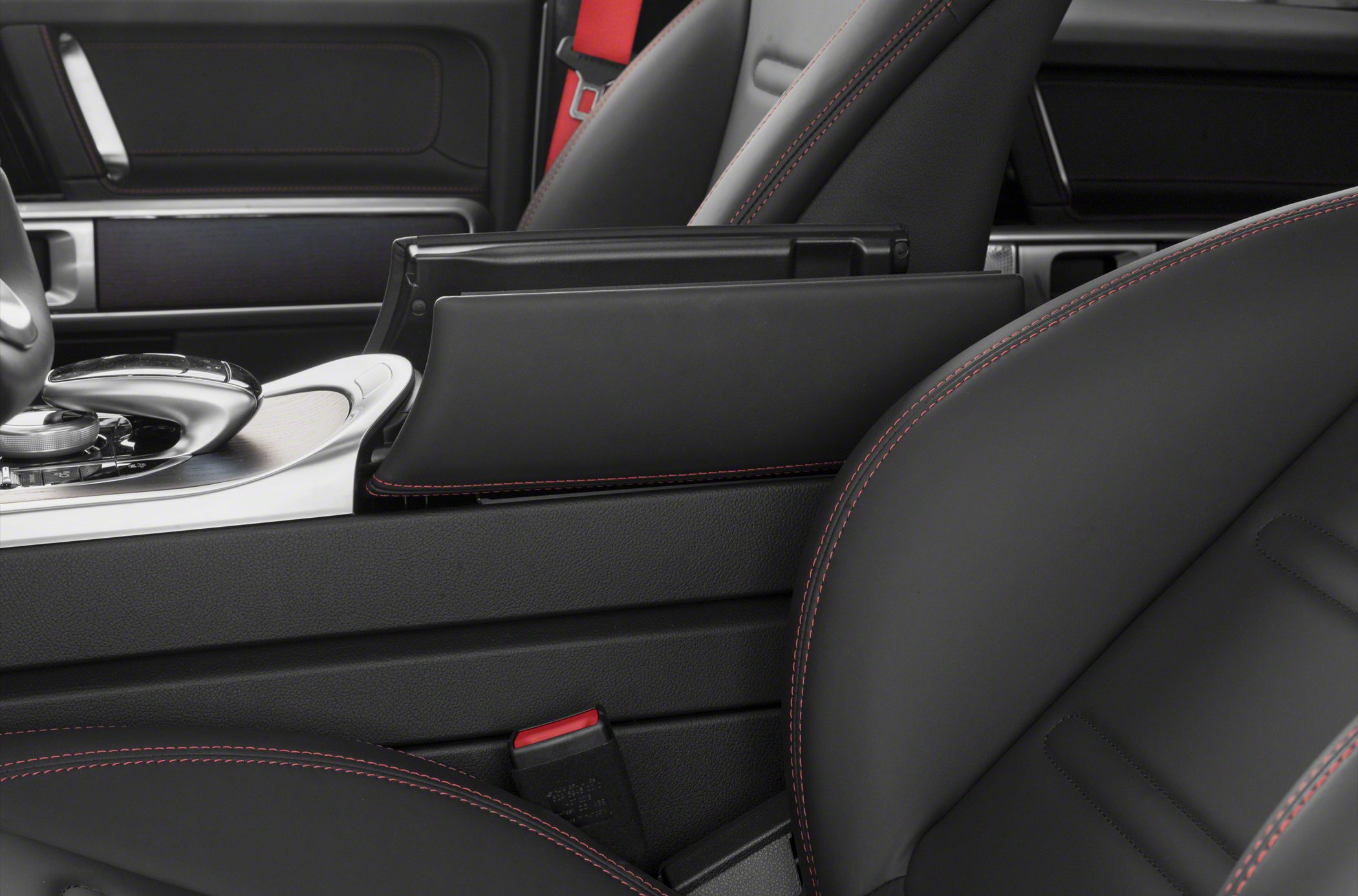 Black leather seats with red stitching and center armrest detail