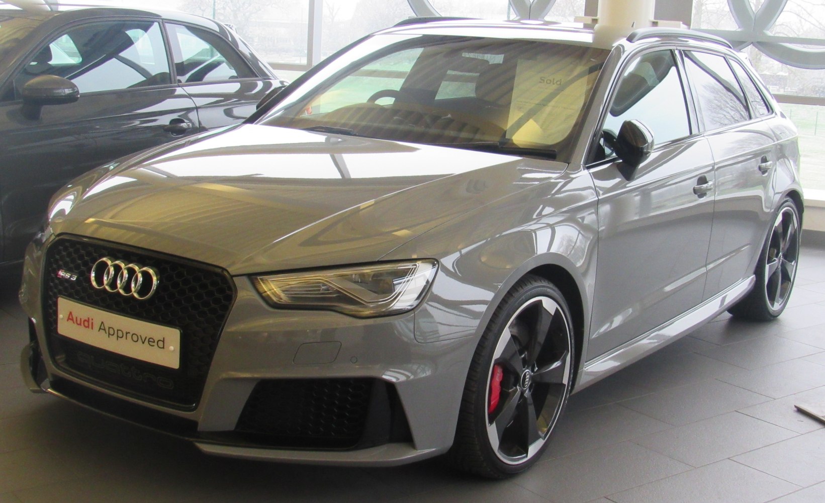 Aggressive front honeycomb grille and five-spoke alloy wheels