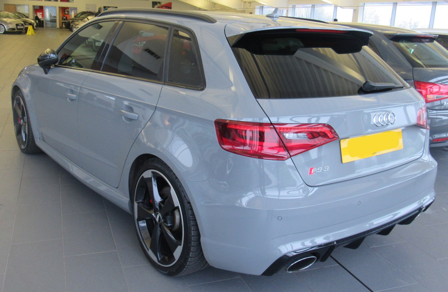 Rear view with LED tail lights and black alloy wheels