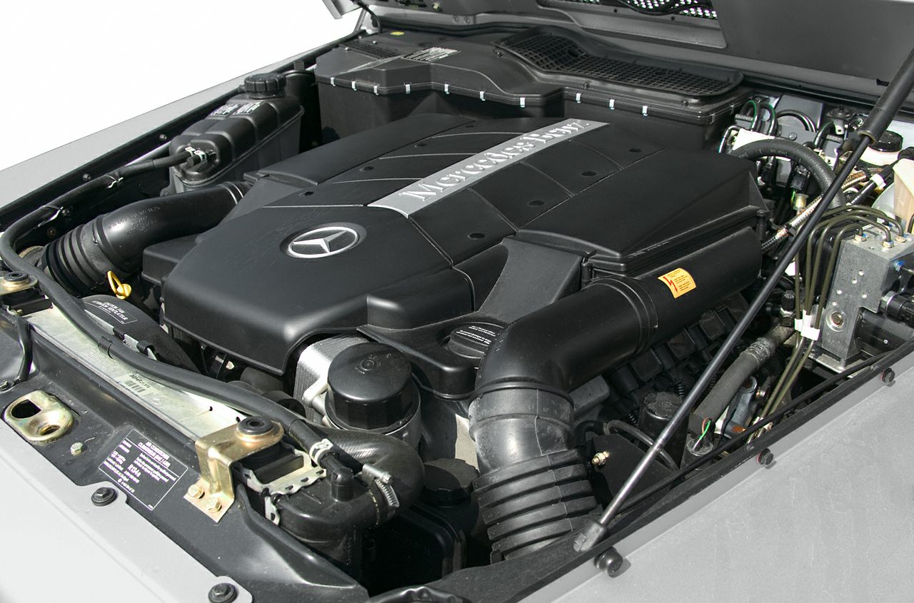 Engine bay with Mercedes-Benz branded engine cover and pipes