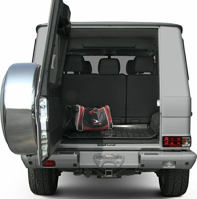 Open rear cargo area with door and visible rear seats