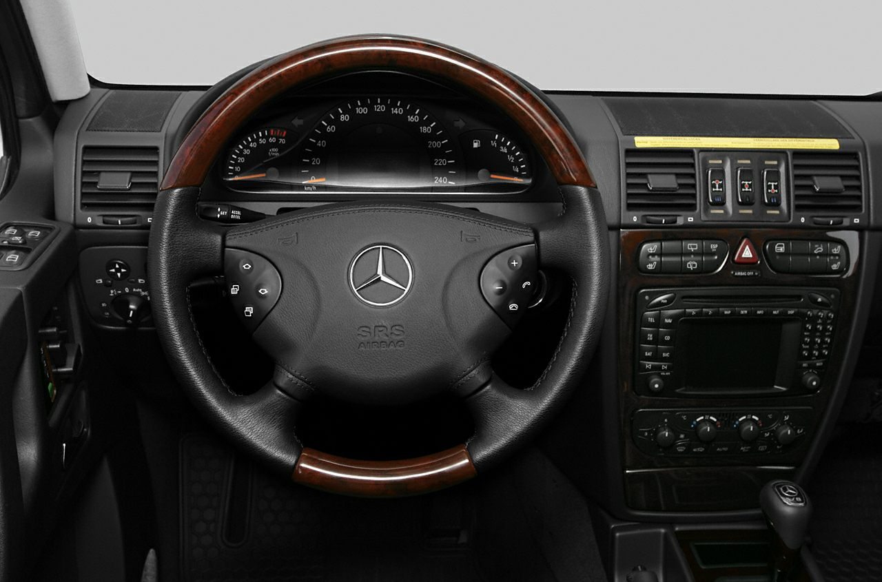 Wood-trimmed steering wheel and detailed dashboard controls