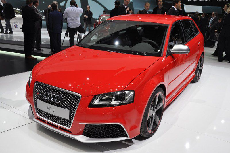 Red sporty hatchback front and side profile with honeycomb grille and alloy wheels