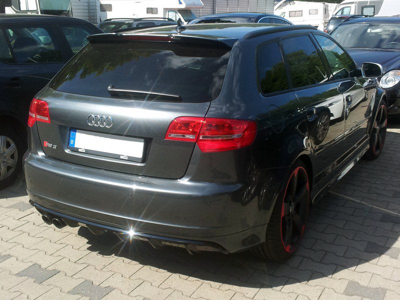 Rear view with quad exhausts and tinted windows