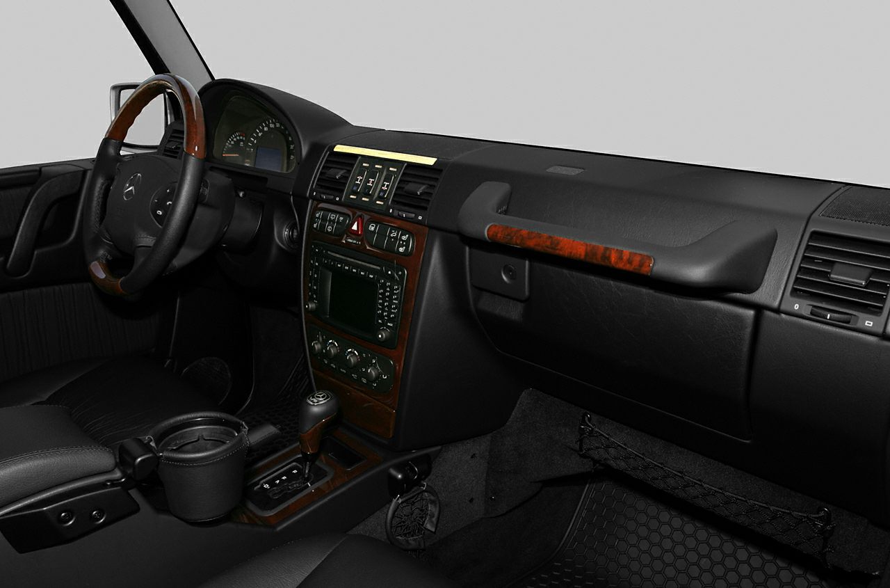 Interior with wood trim, steering wheel, and dashboard