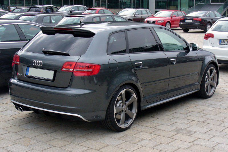 Rear side view of sporty hatchback with large wheels