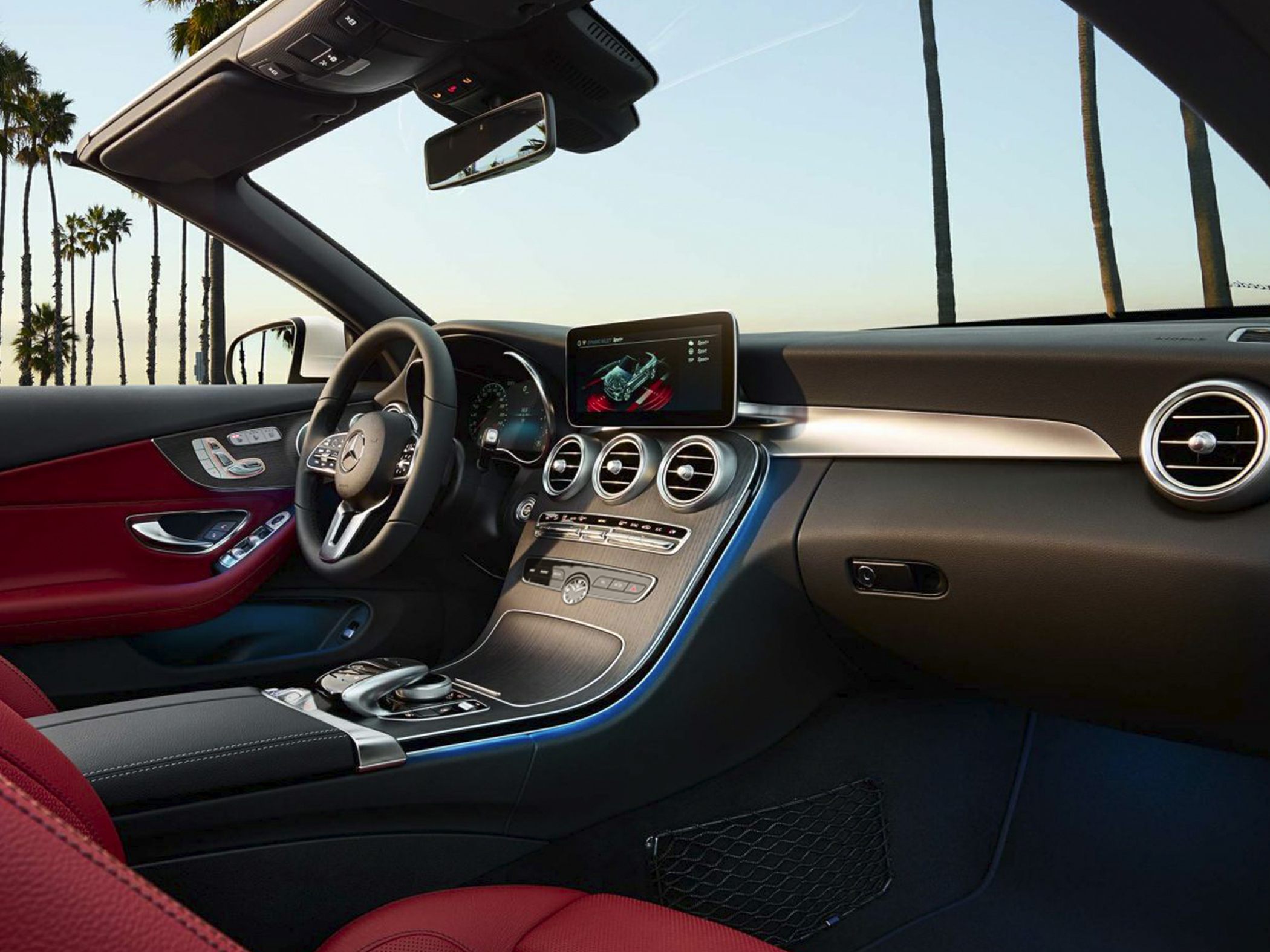 Luxury dashboard with infotainment screen and red leather seats