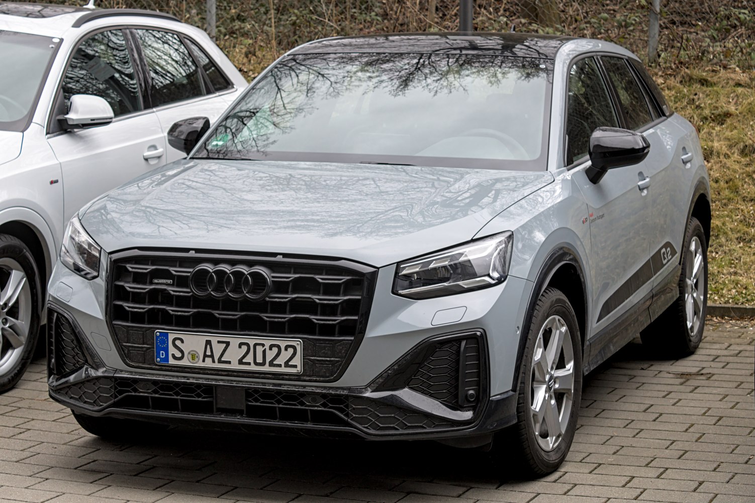 Front view with black honeycomb grille and LED headlights