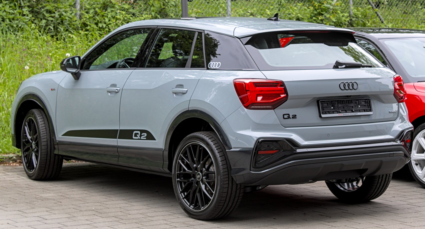 Rear and side view of compact SUV with LED taillights and black wheels
