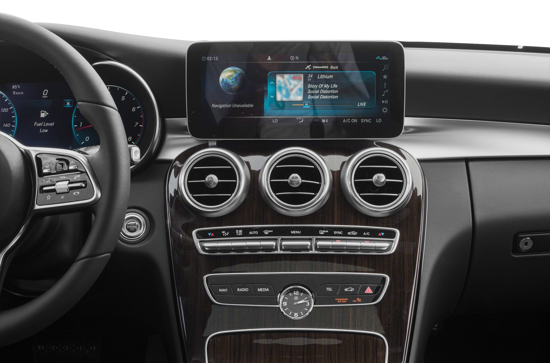 Digital infotainment screen, circular air vents, analog clock, and climate controls in luxury interior
