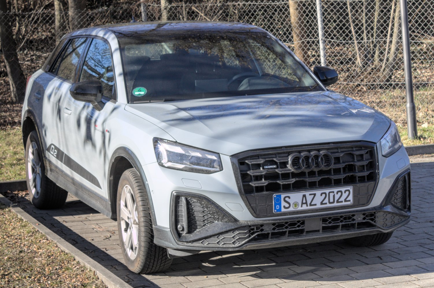 Front view with LED headlights and updated grille of a compact SUV