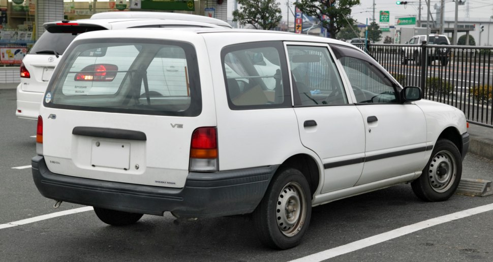 Rear side view of a 1990s station wagon with VE badge