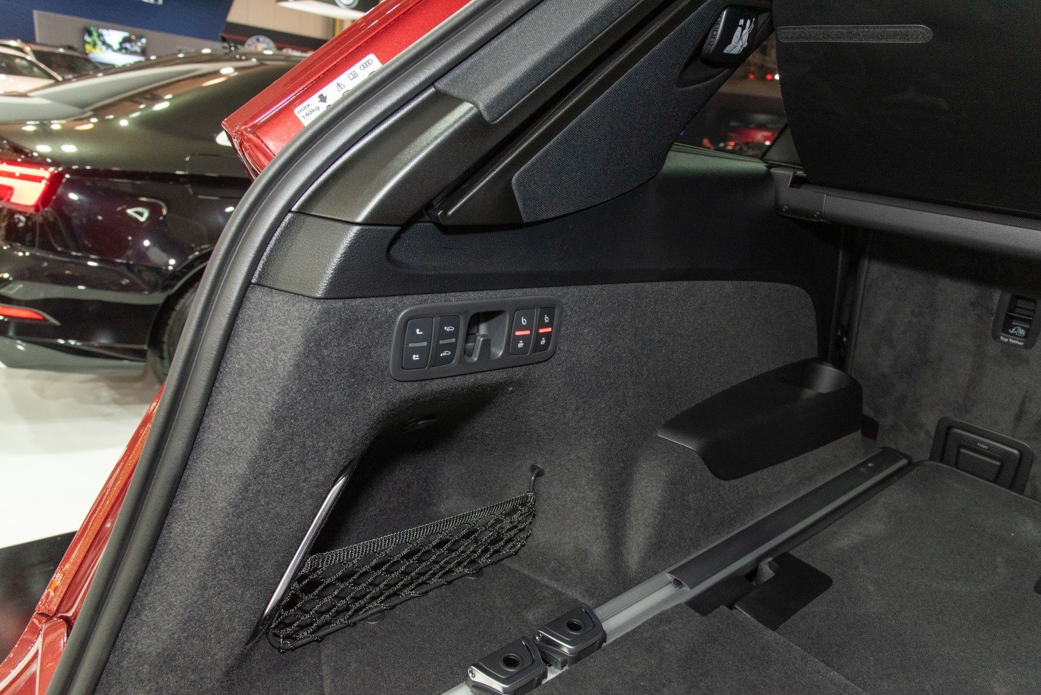 Cargo area controls with storage net and foldable seat mechanisms