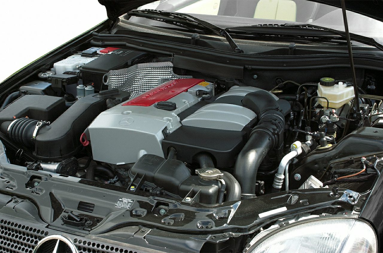 Detailed engine bay with clean motor components and Mercedes signature cover