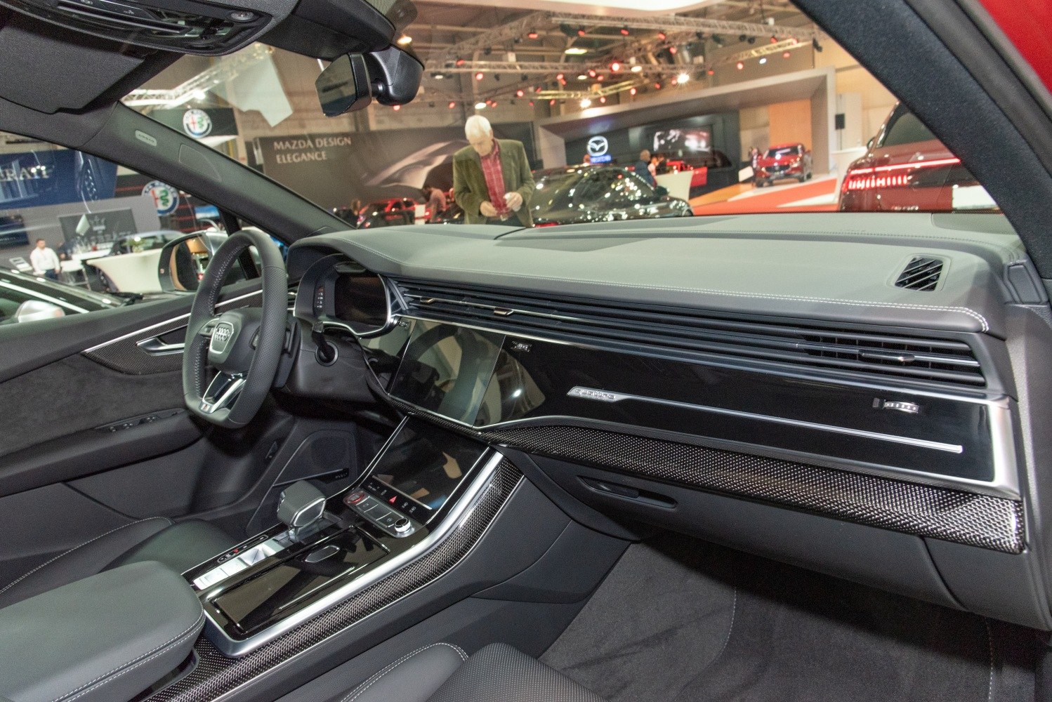 Modern luxury interior with digital dashboard and glossy center console