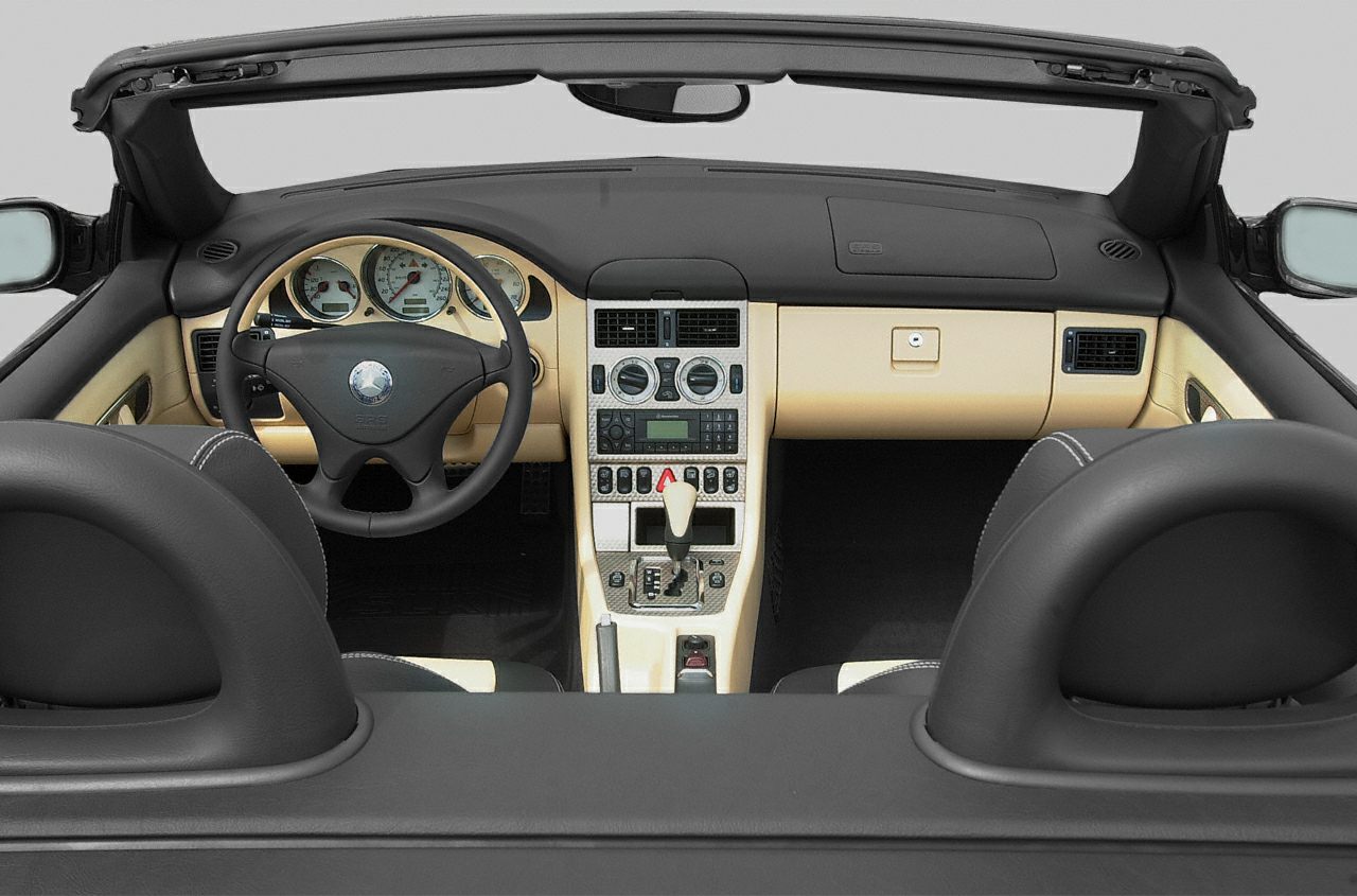 Dashboard, center console, and steering wheel of a convertible car interior