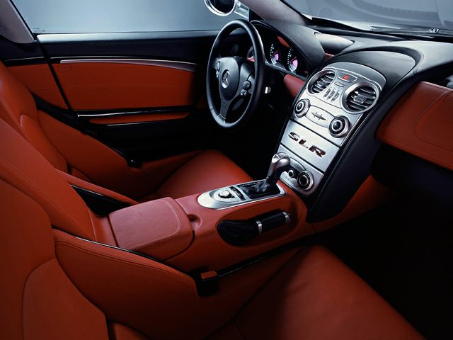 Red leather interior with dashboard and center console.