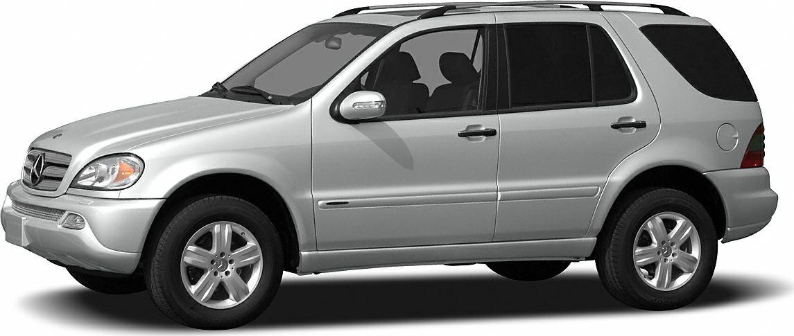 Side profile of a silver mid-size SUV with alloy wheels and roof rails