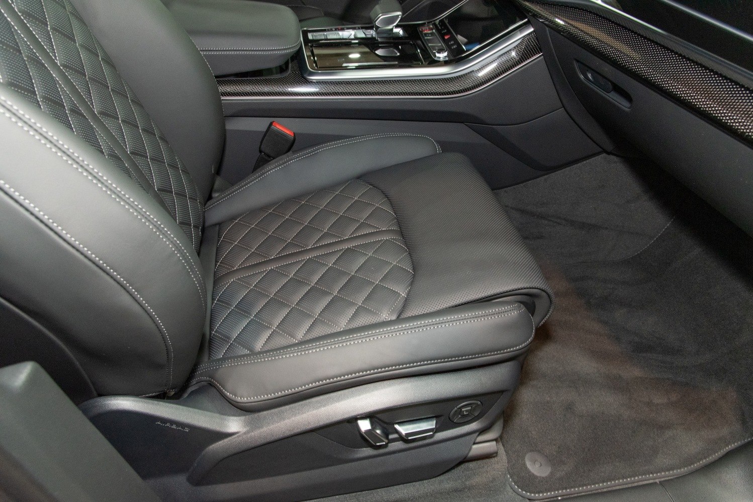Luxury quilted leather front seat with advanced controls and detailed interior trim