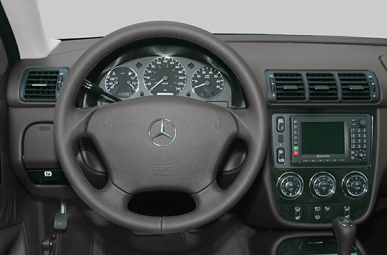 Leather steering wheel and dashboard with instrument cluster and console controls