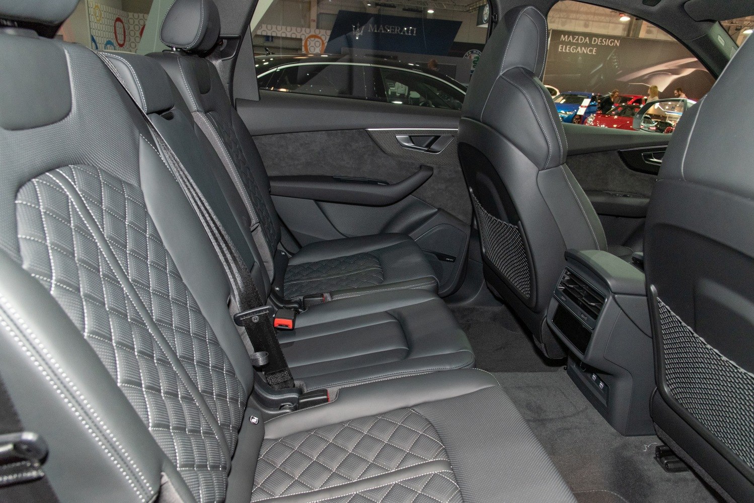 Premium rear leather seats with diamond stitching and comfort features
