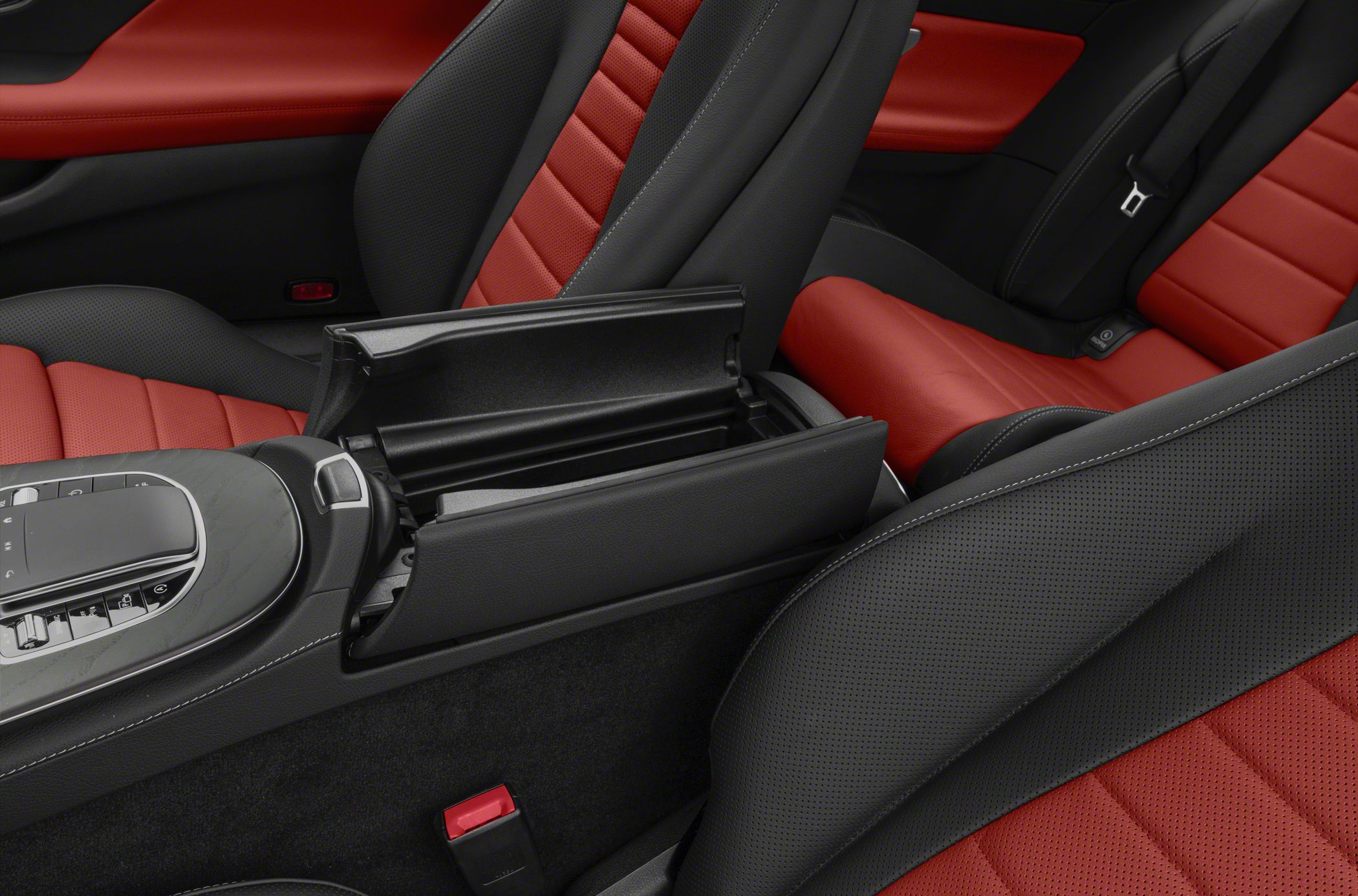 Luxury red and black perforated leather seats with center console storage.