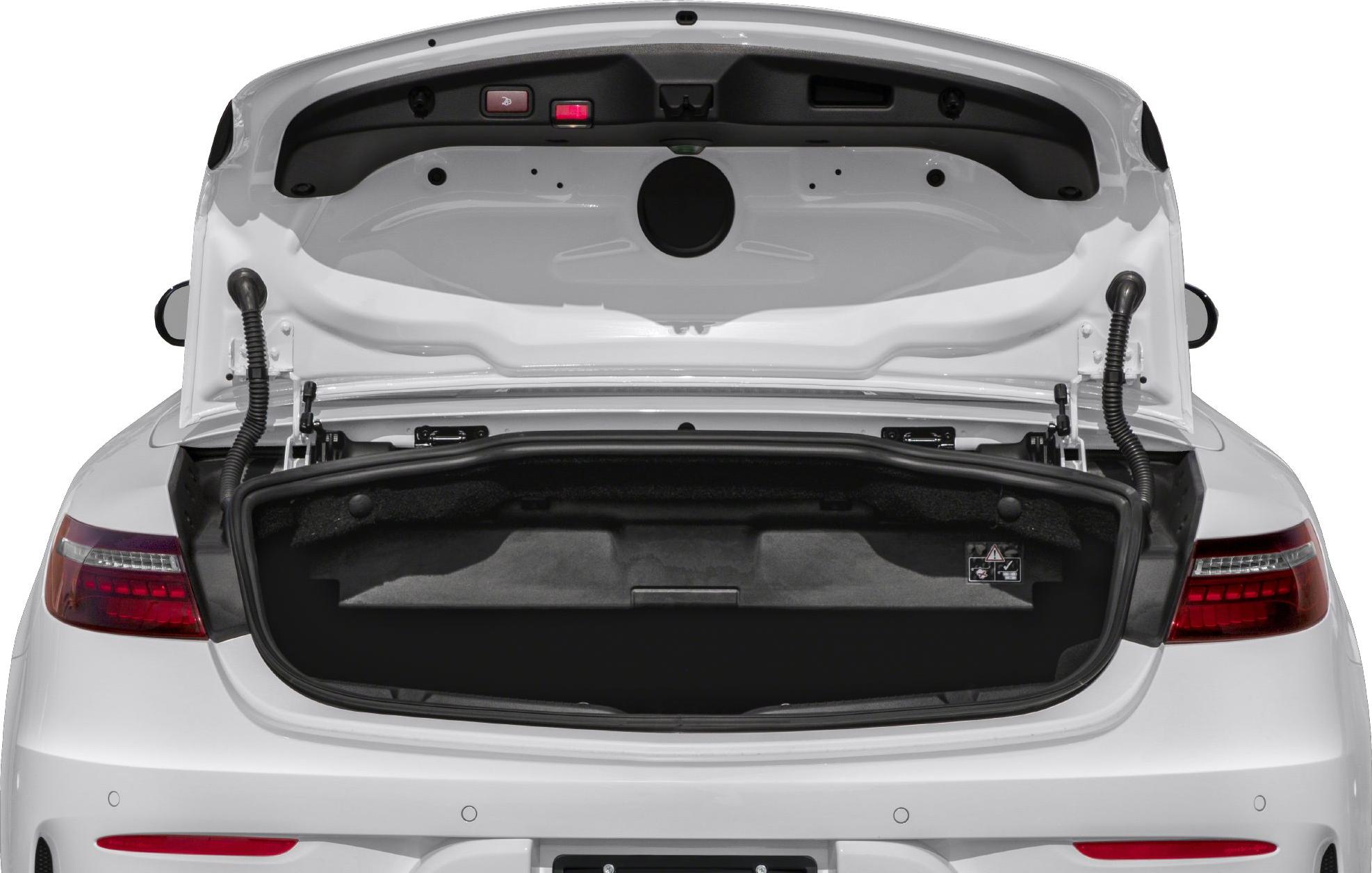 Opened trunk with visible tail lights and trunk lid interior