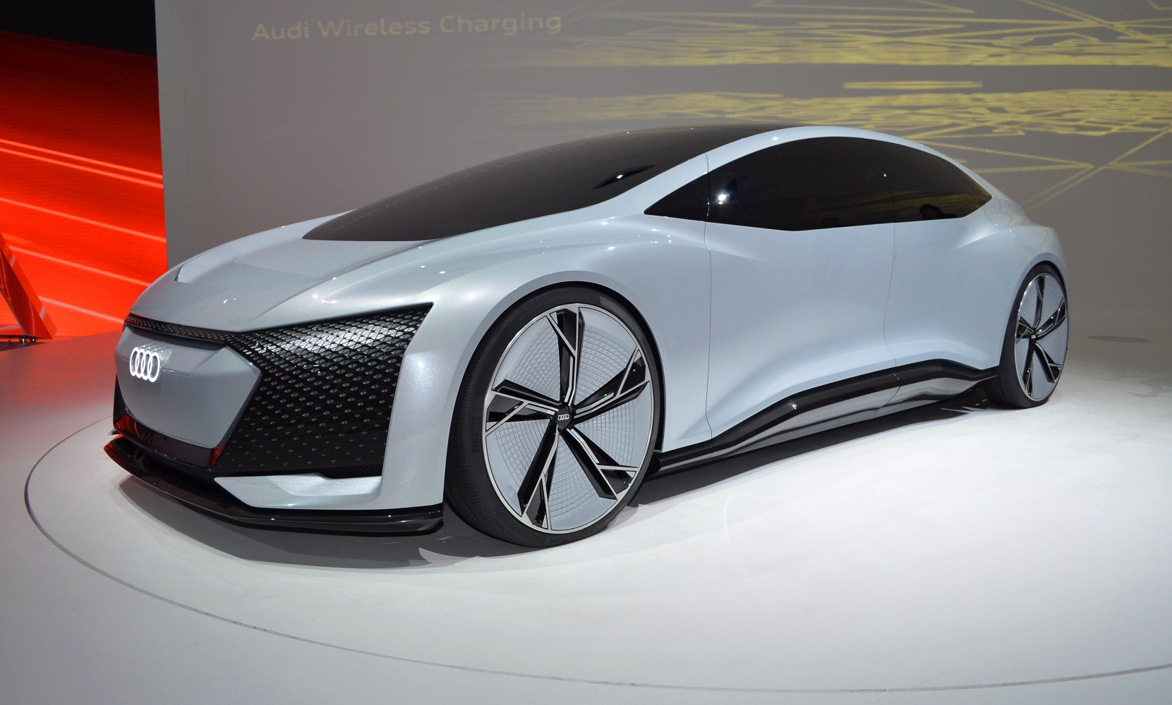 Futuristic electric vehicle design with large aerodynamic wheels and sleek body