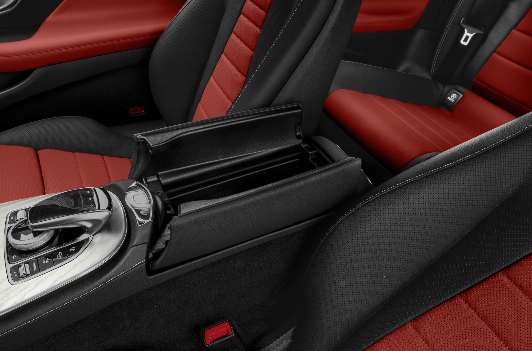 Center console storage with red and black perforated leather seats interior
