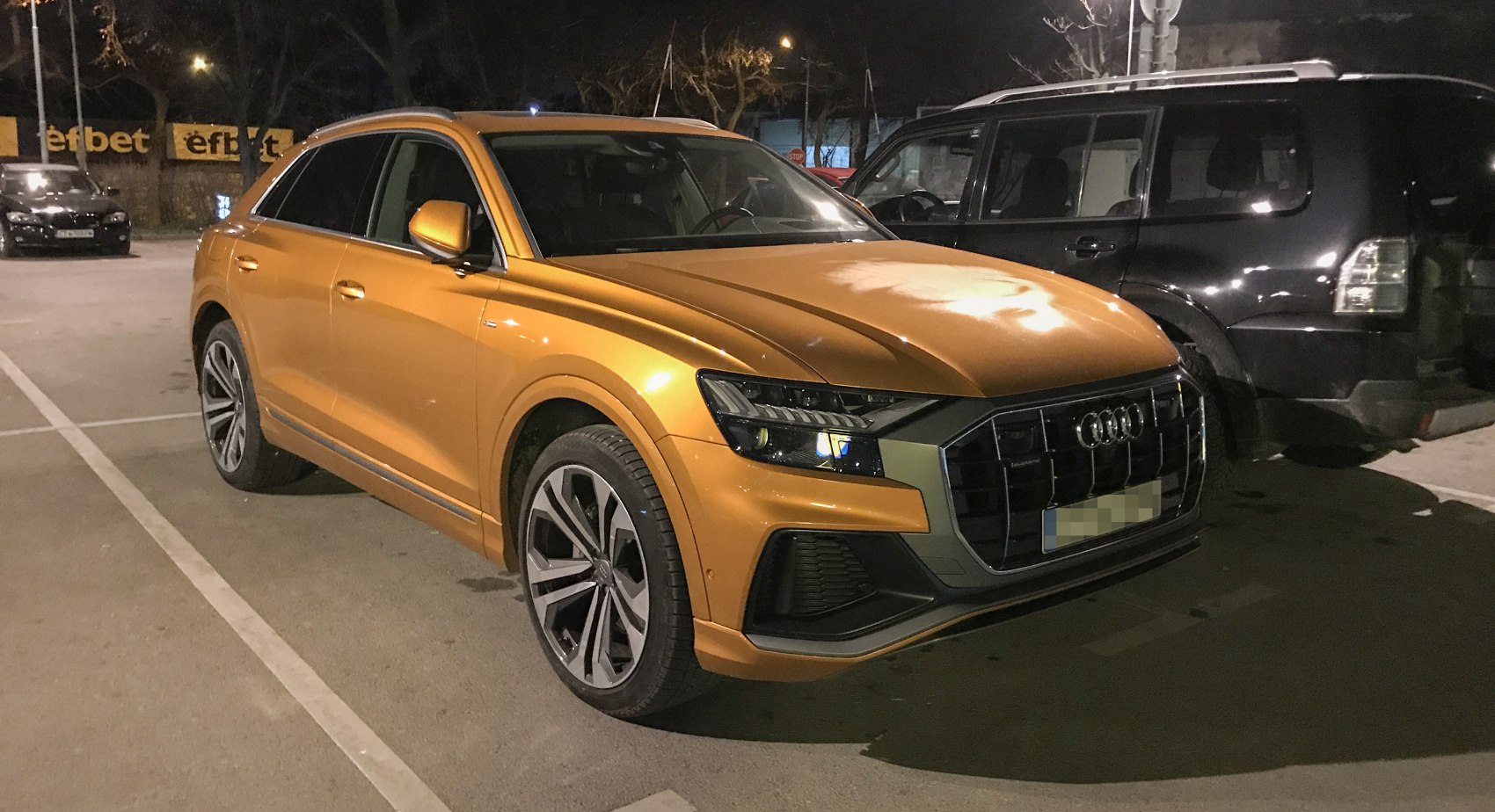 Front and side view with LED headlights and large grille