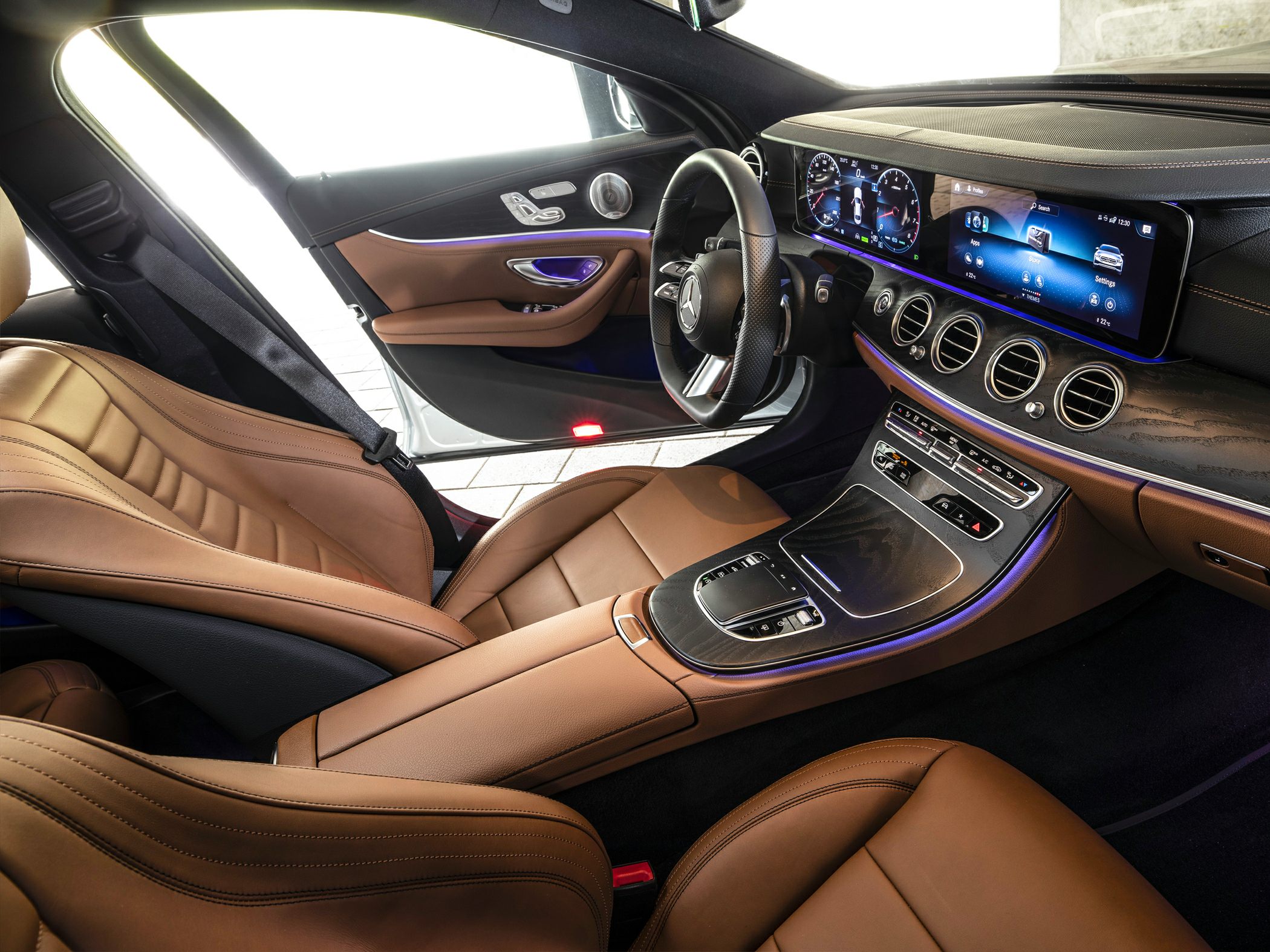 Premium brown leather interior with digital dashboard and ambient lighting