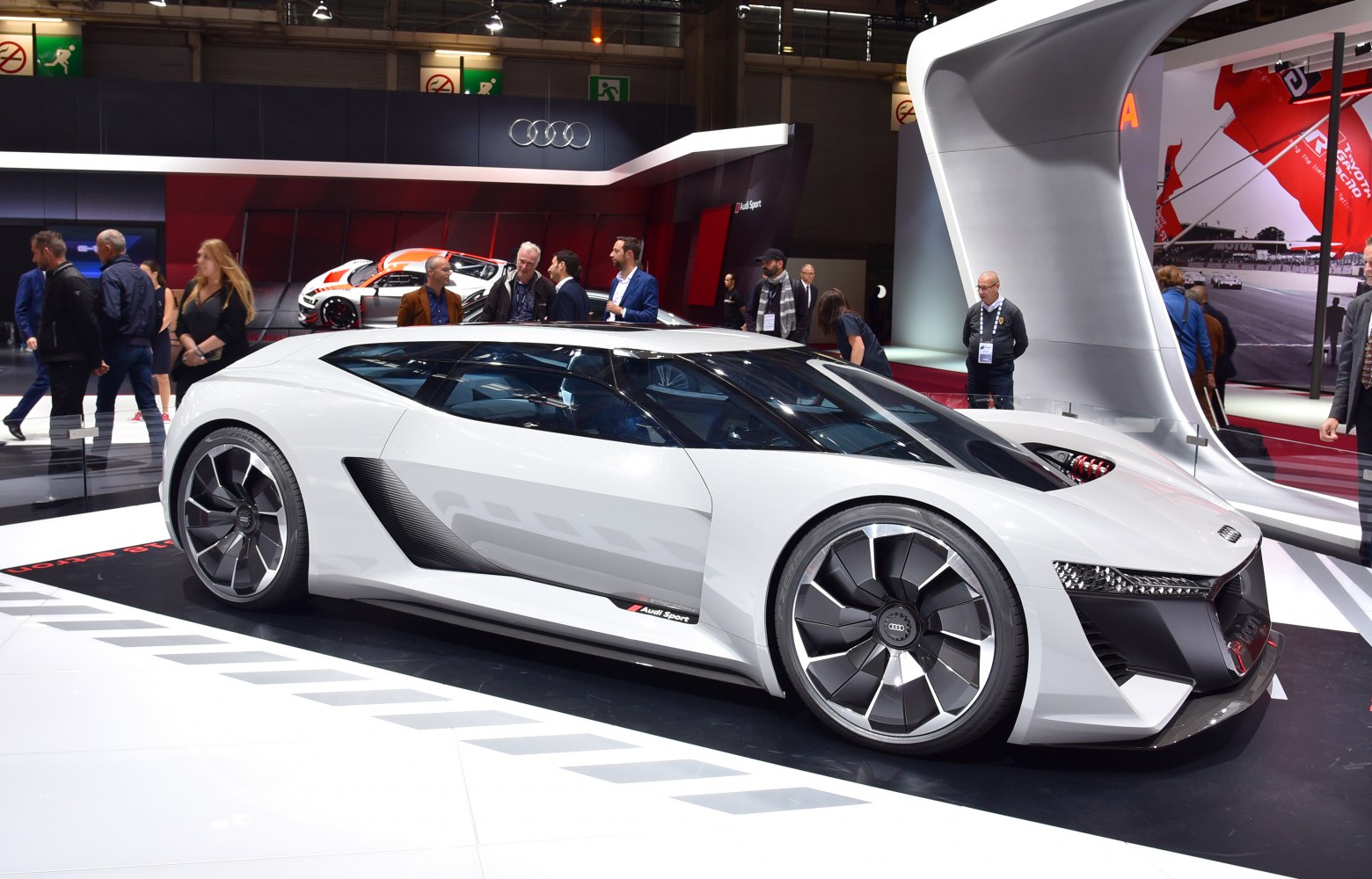 White aerodynamic sports car with futuristic design and large wheels