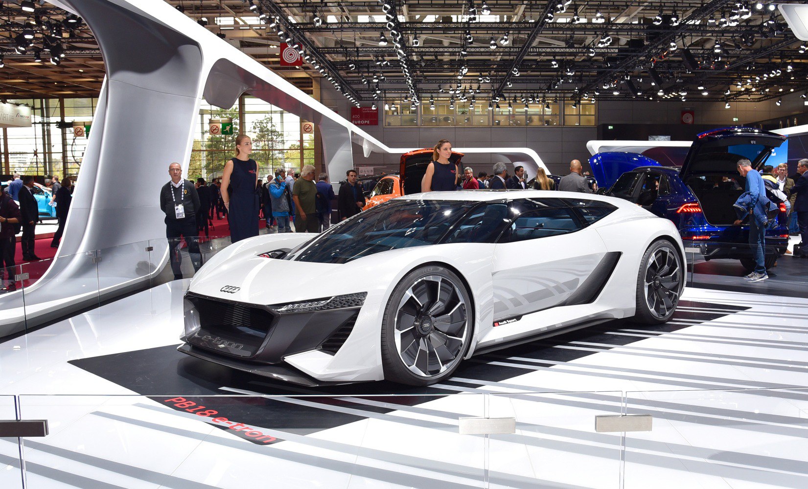 White electric sports coupe with sleek aerodynamic design and large alloy wheels