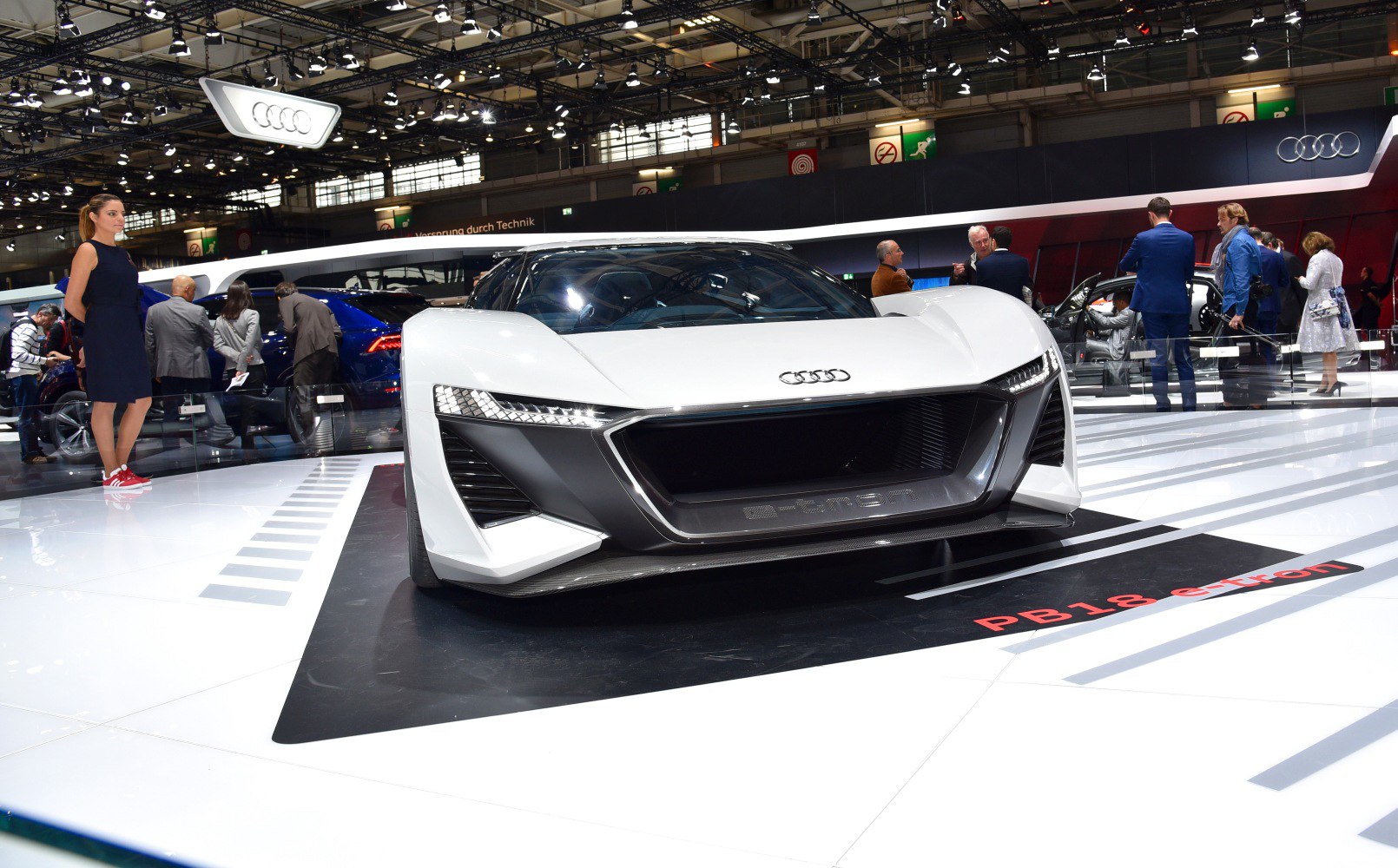 Sleek front view with sharp LED headlights and aggressive grille design