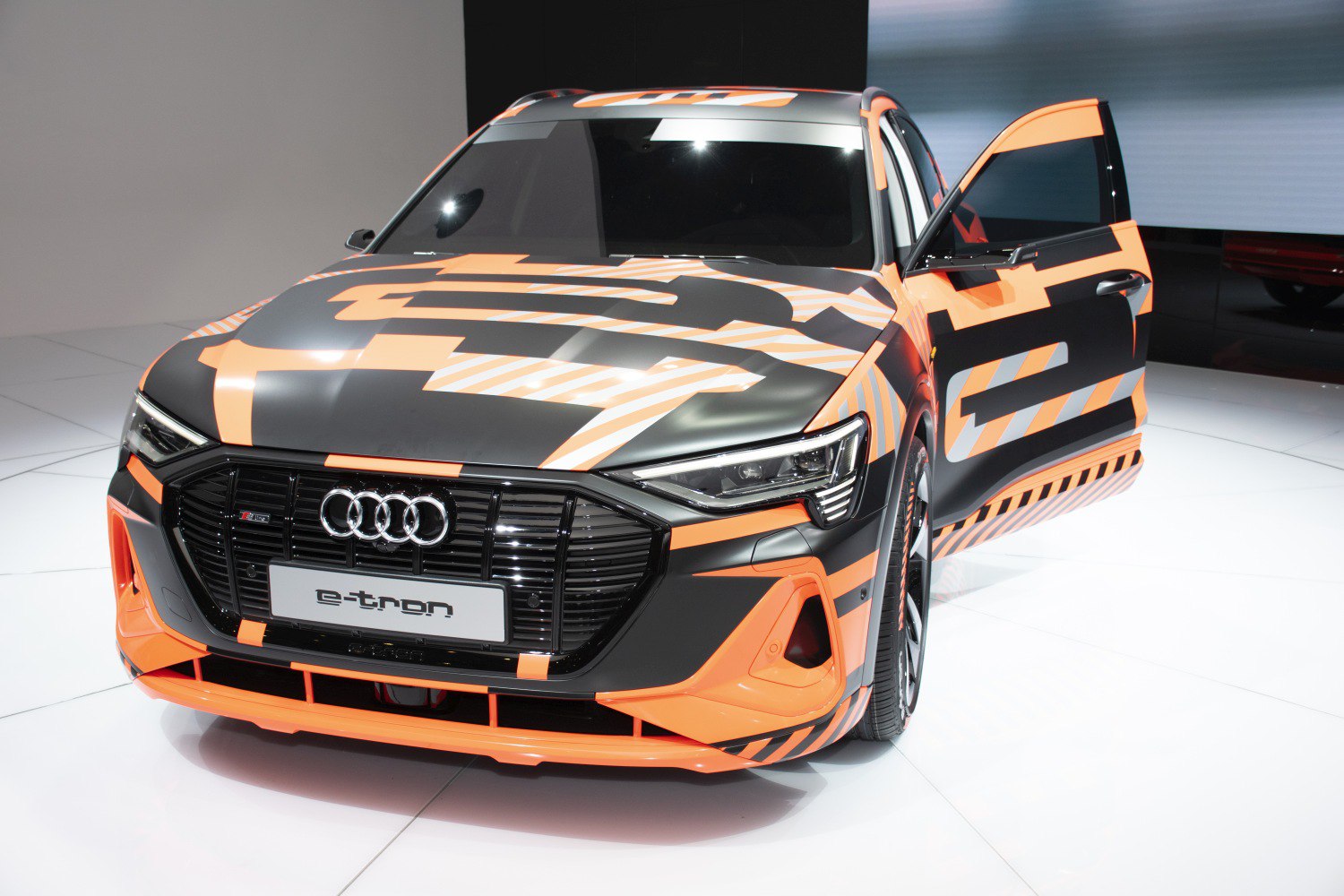 Front view with LED headlights and black orange camouflage wrap