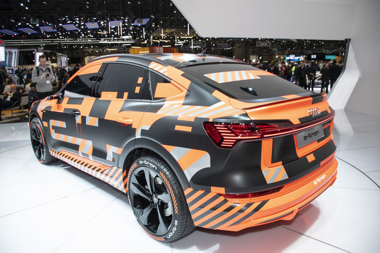 Rear and side view of electric coupe SUV with LED taillights and black alloy wheels