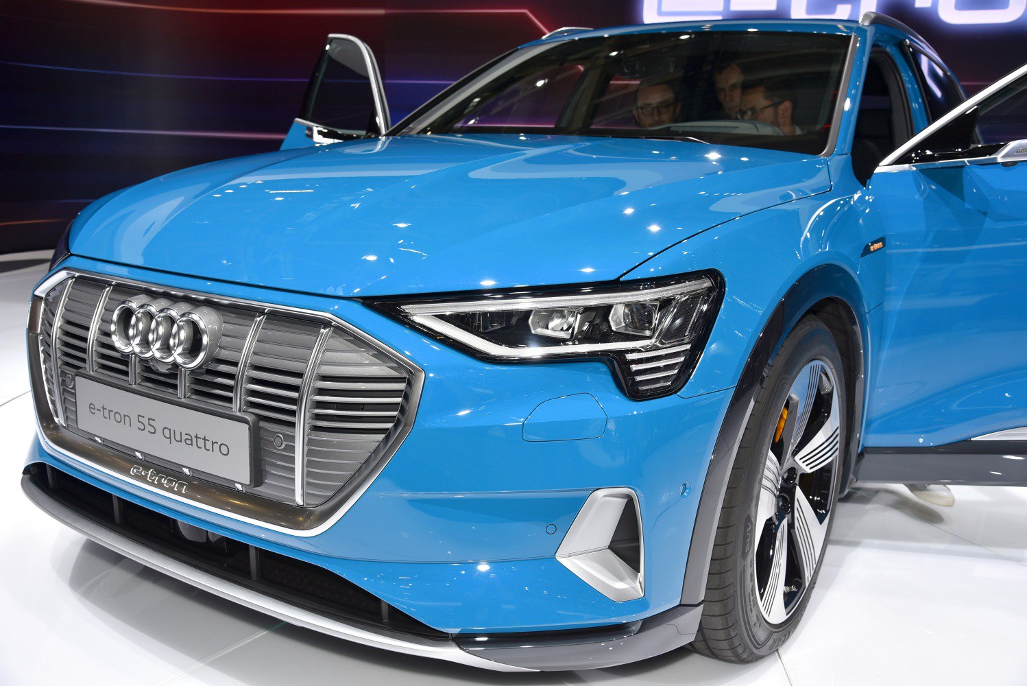 Front grille, LED headlights, and wheel of a modern electric SUV