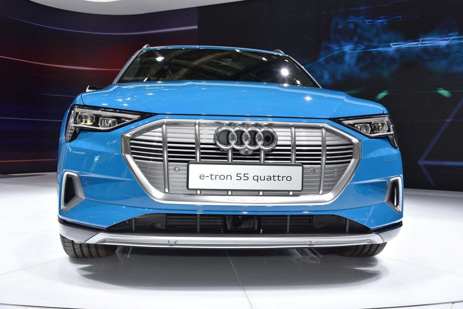 Electric SUV front with distinctive grille and LED headlights