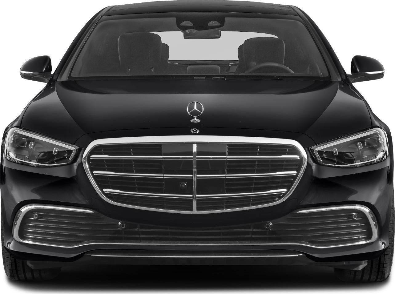 Luxury sedan front view with chrome grille and LED headlights