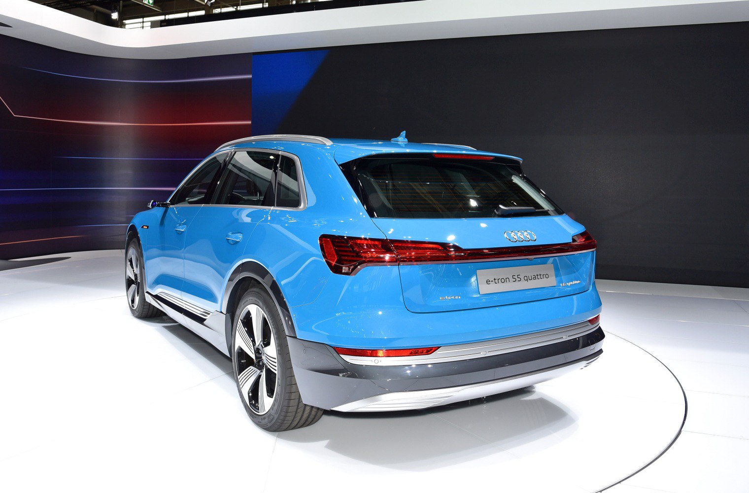 Rear and side view of blue electric SUV showing LED taillights and aerodynamic design