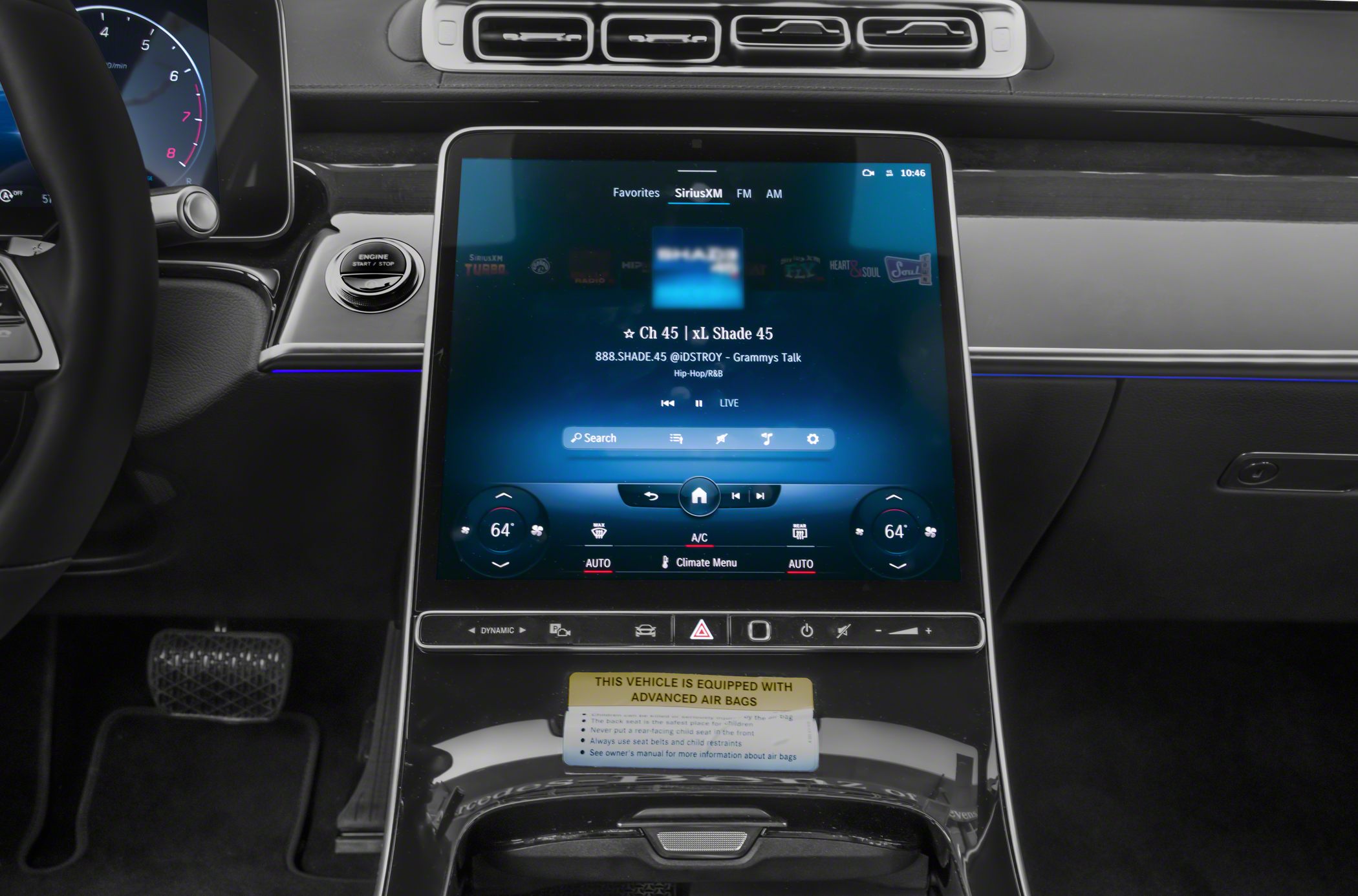 Large vertical touchscreen and dual-zone climate controls centered on dashboard