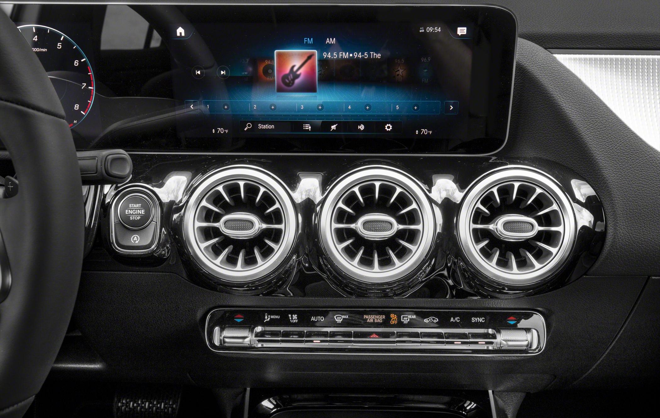 Dashboard with digital infotainment screen and three turbine-style air vents