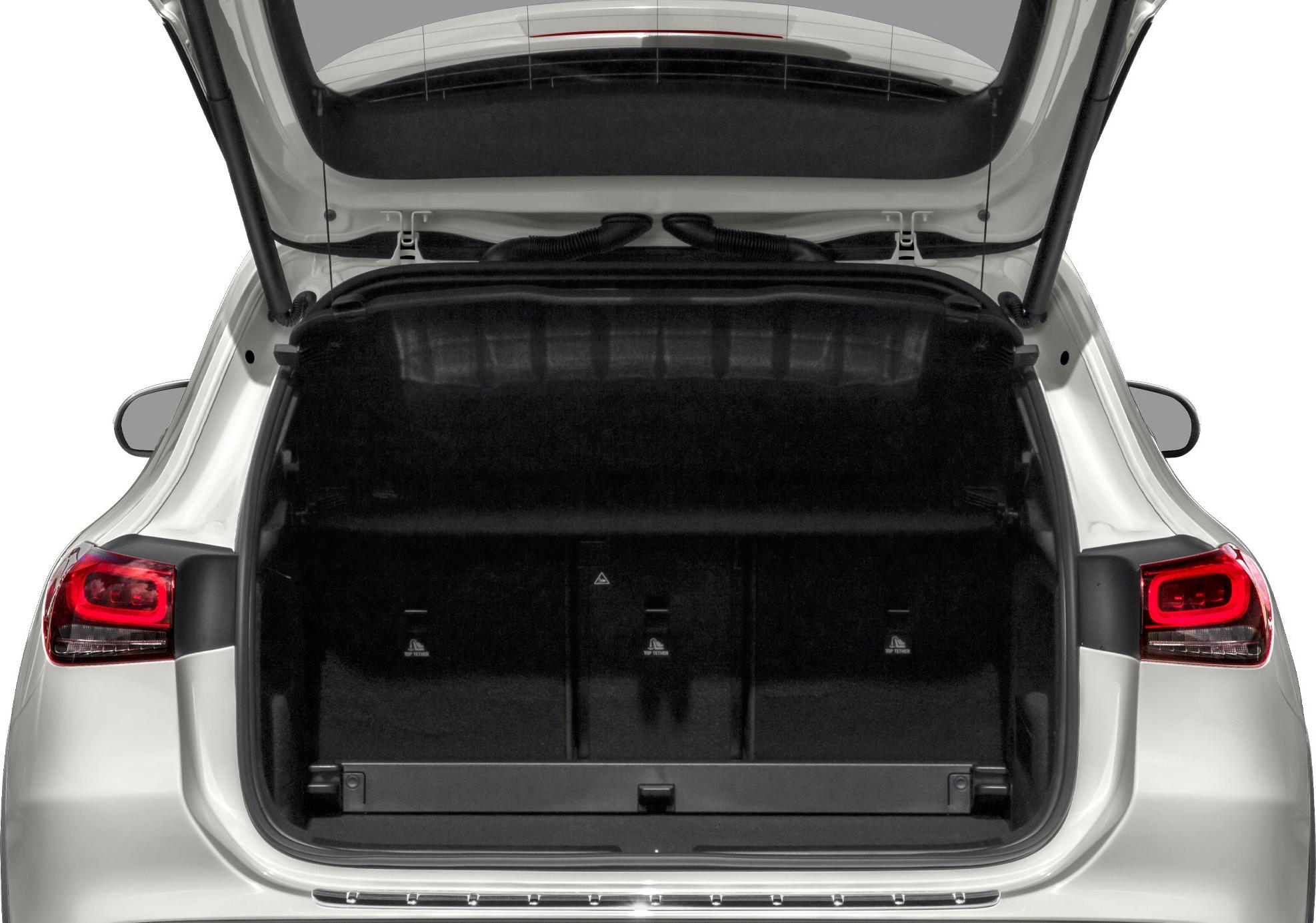 Open rear trunk interior with visible storage space and tailgate hinges