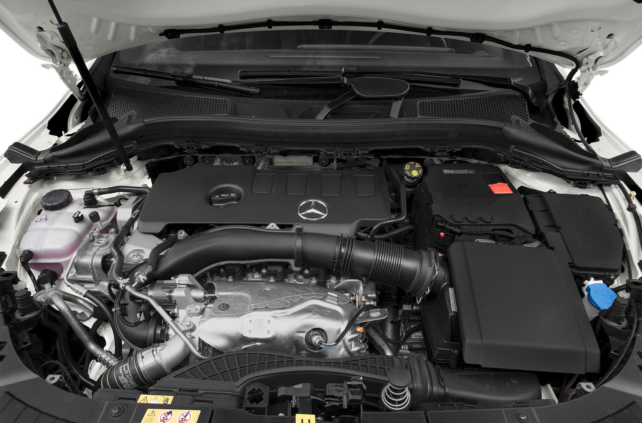 Engine compartment with Mercedes-Benz emblem and engine components